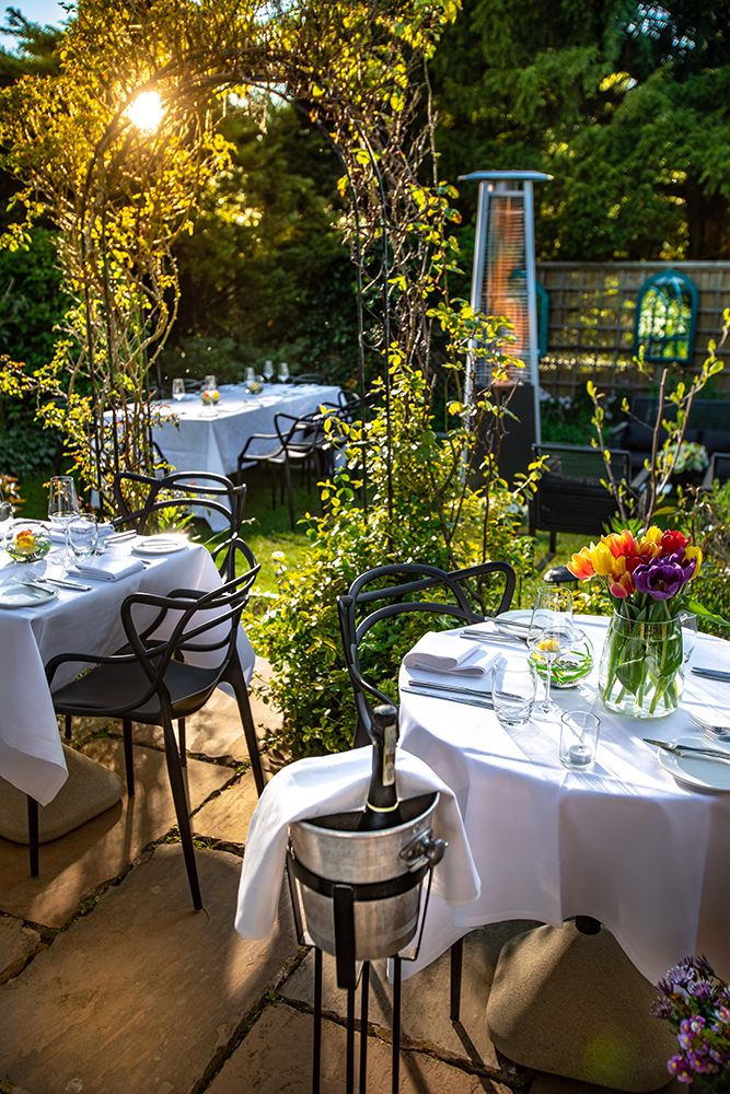 La Popote Secret Garden, Freshly Laid Tables Adorned With Flowers